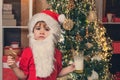 Santa boy child eating cookies and drinking milk. Christmas cookies and milk. Christmas child. Santa Claus eating