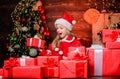 Santa brought me gifts. Child happy excited girl find gifts near christmas tree. Happiness and joy. Merry christmas Royalty Free Stock Photo