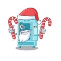 Santa with candy cartoon water vending machine on table Royalty Free Stock Photo