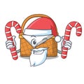 Santa with candy picnic basket mascot cartoon