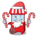 Santa with candy popcron machine in the cartoon column Royalty Free Stock Photo