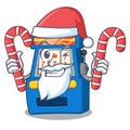 Santa with candy slot machine attached to cartoon wall Royalty Free Stock Photo