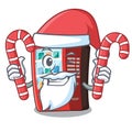 Santa with candy toy vending machine above cartoon table Royalty Free Stock Photo