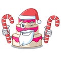 Santa with candy wedding cake isolated with the mascot