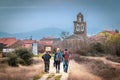 Santa Catalina de Somosa, Spain - Three Pilgrims Walking into Santa Catalina on the Way of St James Camino de Santiago