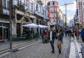 Santa Catarina street Porto wth people walking. Man and woman in the foreground