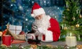 Santa checks toys for quality in his workshop at the north pole Royalty Free Stock Photo