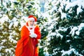 Santa on Christmas Eve is carrying presents to children in a red bag. Merry Christmas and Happy New Year concept