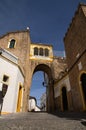 Santa Clara archway over a cobblestone street at Elvas, Portugal Royalty Free Stock Photo