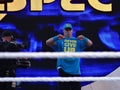 WWE Wrestler John Cena holds towel saying Never Give Up as he enters the stadium Royalty Free Stock Photo
