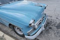 Front of old refurbished blue retro Chevrolet car. Close-up. Side view.