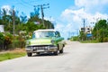 American green 1957 vintage car on the country street to Havana City Cuba - Serie Cuba Reportage