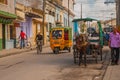 Santa Clara, Cuba: Taxi-motorcycle. Horse-drawn carriage. Horse cart to transport people in Cuba.