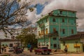 SANTA CLARA, CUBA: The usual street in the city. Green multi-storey building.