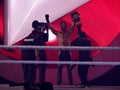 At close of Wrestlemania 31 as Seth Rollins celebrates championship victory by holding title in the air