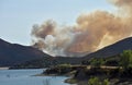 The Martindale Fire burns through thick vegetation near the Bouquet Canyon Reservoir Dam Monday afternoon.
