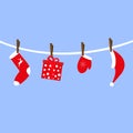 Santa Claus accessories hang on clothespins