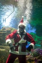 Santa Claus with aqualung under water