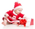 Santa Claus baby girl opening gift box Royalty Free Stock Photo