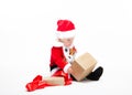 Santa Claus baby in red christmas clothes with gift box isolated on white Royalty Free Stock Photo