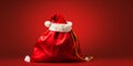 Santa claus bag full of gifts and decorations on red background, copy space. Merry Christmas shopping Royalty Free Stock Photo