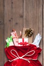 Santa Claus Bag Full By Present Gift Box, Red Christmas Sack on Old Wood Wall Background Royalty Free Stock Photo