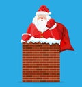 Santa claus with bag with gifts in house chimney Royalty Free Stock Photo