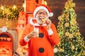 Santa Claus with beard and mustache. Santa Claus in hat. Christmas for Santa Claus. Santa Claus enjoys cookies and milk Royalty Free Stock Photo