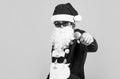 santa claus bearded man singer hold microphone wish happy new year and merry christmas holiday ready to celebrate winter Royalty Free Stock Photo