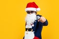 Santa claus bearded man singer hold microphone wish happy new year and merry christmas holiday ready to celebrate winter Royalty Free Stock Photo