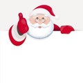 Santa Claus behind blank sheet for text and showing thumb up