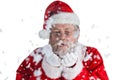 Santa claus blowing fake snow Royalty Free Stock Photo