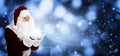 Santa Claus blowing magic snow around, bokeh effect. Space for text Royalty Free Stock Photo