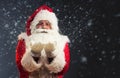 Santa Claus blowing magic snow of his hands Royalty Free Stock Photo