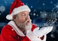 Santa claus blowing a snow Royalty Free Stock Photo