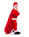 Santa Claus boy carrying gift bag Royalty Free Stock Photo