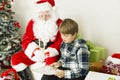 Santa claus with a boy Royalty Free Stock Photo
