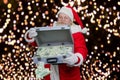 Santa Claus with briefcase full of dollars. Royalty Free Stock Photo