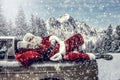 Santa Claus in a car driving to deliver some christmas presents on a sunny winter day. Blurred mountain forest background. Royalty Free Stock Photo