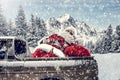 Santa Claus in a car driving to deliver some christmas presents on a sunny winter day. Blurred mountain forest background. Royalty Free Stock Photo