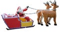 Santa Claus carries gifts in a sleigh harnessed by deer, decorative sculpture, isolated, white background