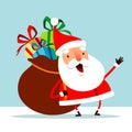 Santa Claus carrying a bag with full of Christmas gift box presents Royalty Free Stock Photo