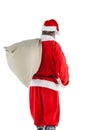 Santa claus carrying bag full of gifts Royalty Free Stock Photo