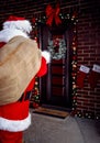 Santa Claus carrying bag with present for children in night Royalty Free Stock Photo