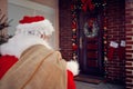 Santa Claus carrying bag with present in night Royalty Free Stock Photo