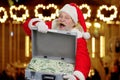 Santa Claus with case full of cash. Royalty Free Stock Photo