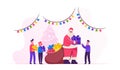 Santa Claus Character Giving Gifts to Happy Children on School or Kindergarten Matinee Standing in Room with Christmas Royalty Free Stock Photo