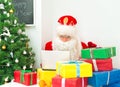 Santa Claus checking wish list. Royalty Free Stock Photo