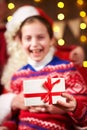 Santa Claus and child girl posing together indoor near decorated xmas tree with lights, they talking and smiling - Merry Christmas Royalty Free Stock Photo