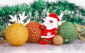 Santa Claus with Christmas balls and white snowflakes Royalty Free Stock Photo